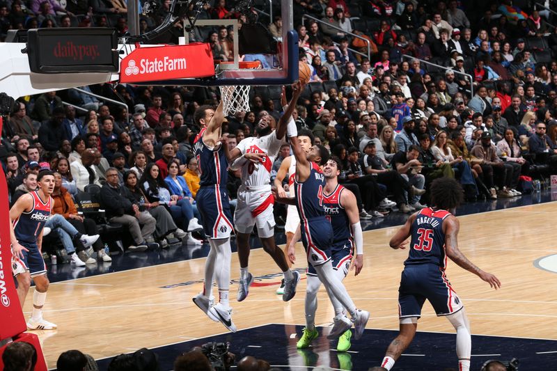 WASHINGTON, DC -? MARCH 23:  Javon Freeman-Liberty #0 of the Toronto Raptors goes to the basket during the game on March 23, 2024 at Capital One Arena in Washington, DC. NOTE TO USER: User expressly acknowledges and agrees that, by downloading and or using this Photograph, user is consenting to the terms and conditions of the Getty Images License Agreement. Mandatory Copyright Notice: Copyright 2024 NBAE (Photo by Stephen Gosling/NBAE via Getty Images)