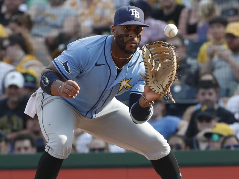 Jun 22, 2024; Pittsburgh, Pennsylvania, USA;  Tampa Bay Rays first baseman Yandy Díaz (2) takes a throw to retire Pittsburgh Pirates third baseman Ke'Bryan Hayes (not pictured) to end the sixth inning at PNC Park. The Pirates won 4-3. Mandatory Credit: Charles LeClaire-USA TODAY Sports