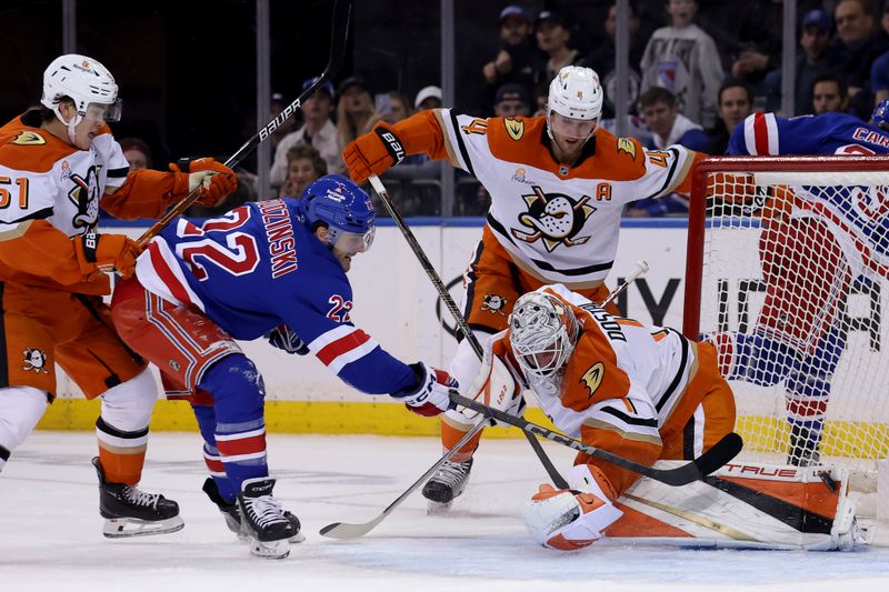 Oct 26, 2024; New York, New York, USA; Anaheim Ducks goaltender Lukas Dostal (1) makes a save on a shot by New York Rangers center Jonny Brodzinski (22) during the first period at Madison Square Garden. Mandatory Credit: Brad Penner-Imagn Images