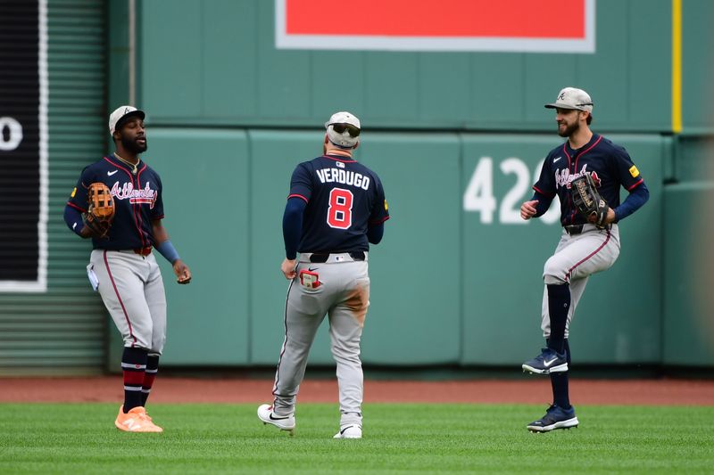 May 18, 2025; Boston, Massachusetts, USA;  Atlanta Braves center fielder Michael Harris II (23) left fielder Alex Verdugo (8) and right fielder Eli White (36) react after defeating the Boston Red Sox at Fenway Park. Mandatory Credit: Bob DeChiara-Imagn Images