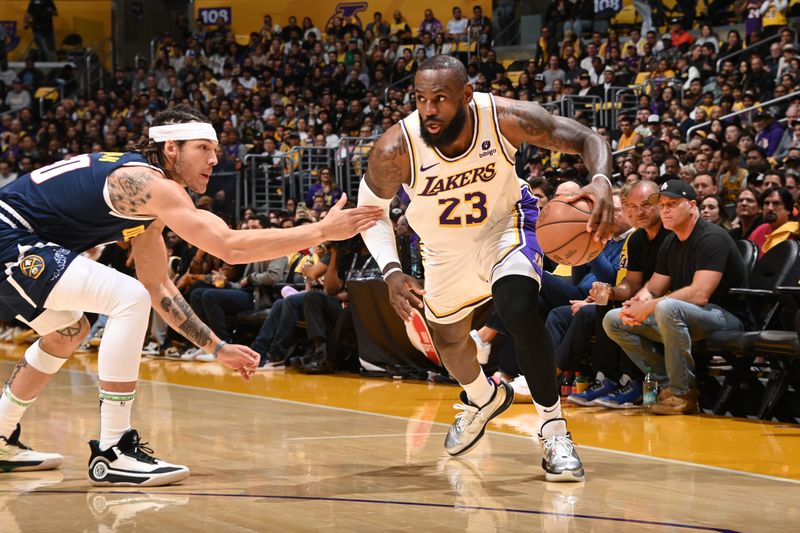 LOS ANGELES, CA - APRIL 27: LeBron James #23 of the Los Angeles Lakers dribbles the ball during the game against the Denver Nuggets during Round 1 Game 4 of the 2024 NBA Playoffs on April 27, 2024 at Crypto.Com Arena in Los Angeles, California. NOTE TO USER: User expressly acknowledges and agrees that, by downloading and/or using this Photograph, user is consenting to the terms and conditions of the Getty Images License Agreement. Mandatory Copyright Notice: Copyright 2024 NBAE (Photo by Andrew D. Bernstein/NBAE via Getty Images)