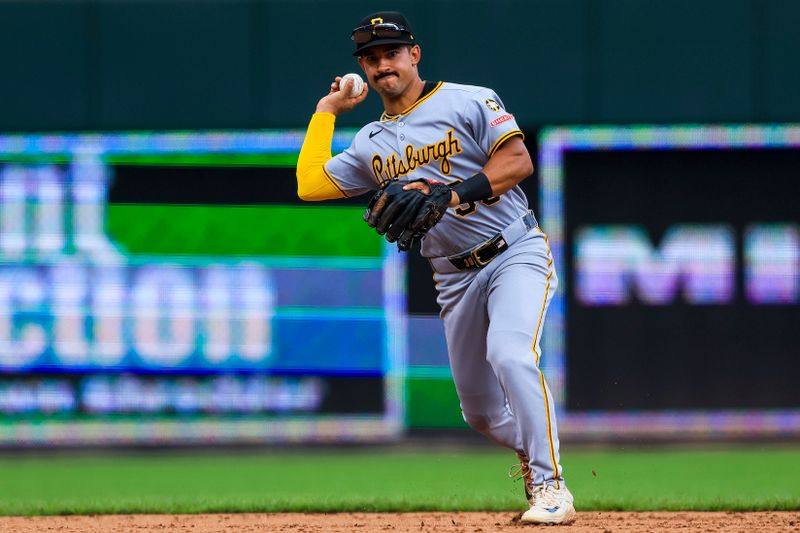Sep 25, 2025; Cincinnati, Ohio, USA; Pittsburgh Pirates shortstop Nick Gonzales (39) throws to first to get Cincinnati Reds designated hitter Miguel Andujar (not pictured) out in the eighth inning at Great American Ball Park. Mandatory Credit: Katie Stratman-Imagn Images