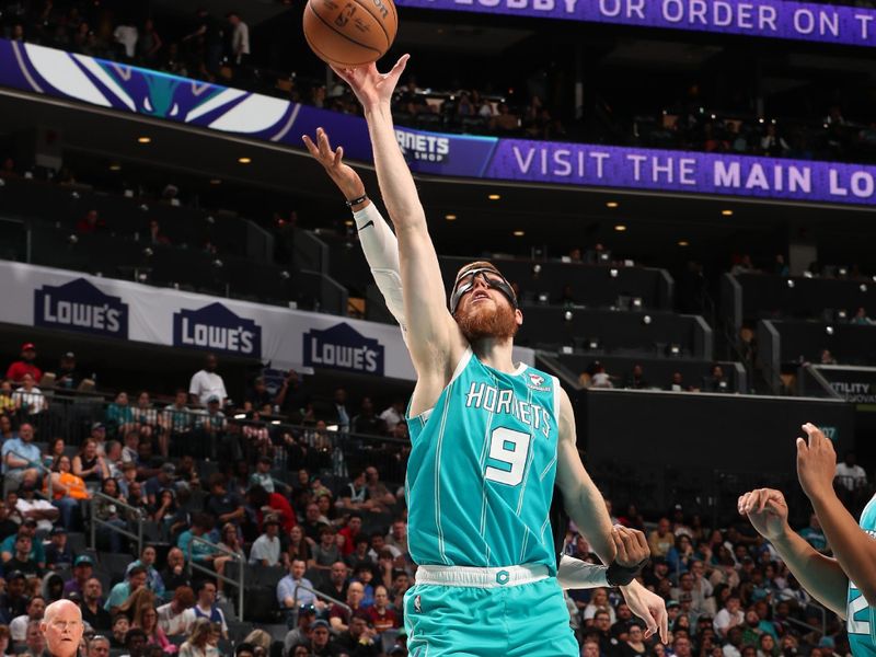 CHARLOTTE, NC - MARCH 31: Davis Bertans #9 of the Charlotte Hornets grabs the rebound during the game against the LA Clippers on March 31, 2024 at Spectrum Center in Charlotte, North Carolina. NOTE TO USER: User expressly acknowledges and agrees that, by downloading and or using this photograph, User is consenting to the terms and conditions of the Getty Images License Agreement. Mandatory Copyright Notice: Copyright 2024 NBAE (Photo by Kent Smith/NBAE via Getty Images)