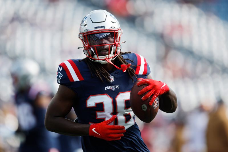 New England Patriots running back Rhamondre Stevenson (38) warms up prior to an NFL football game against the Washington Commanders, Sunday, Nov. 5, 2023, in Foxborough, Mass. (AP Photo/Michael Dwyer)