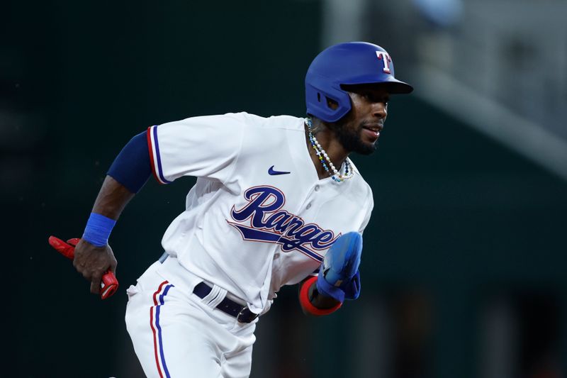 Aug 14, 2023; Arlington, Texas, USA; Texas Rangers left fielder Julio Pablo Martinez (50) rounds third base to score a run in the second inning against the Los Angeles Angels at Globe Life Field. Mandatory Credit: Tim Heitman-USA TODAY Sports