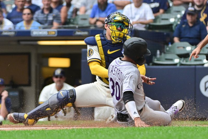 Aug 9, 2023; Milwaukee, Wisconsin, USA;  Milwaukee Brewers catcher William Contreras (24) tags out Colorado Rockies second baseman Harold Castro (30) in the seventh inning at American Family Field. Mandatory Credit: Benny Sieu-USA TODAY Sports