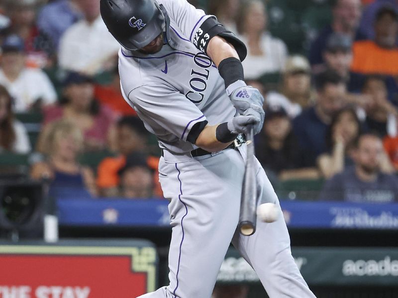 Jul 4, 2023; Houston, Texas, USA; Colorado Rockies designated hitter Kris Bryant (23) hits a single during the first inning against the Houston Astros at Minute Maid Park. Mandatory Credit: Troy Taormina-USA TODAY Sports