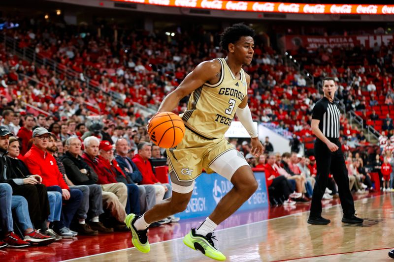 Jan 17, 2026; Raleigh, North Carolina, USA; Georgia Tech Yellow Jackets guard Jaeden Mustaf (3) runs with the ball during the first half of the game against the NC State Wolfpack at Lenovo Center. Mandatory Credit: Jaylynn Nash-Imagn Images