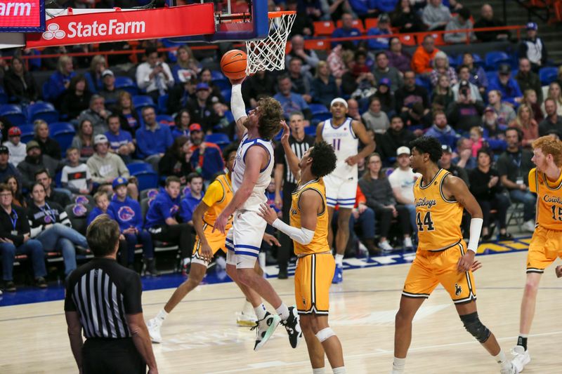 Feb 11, 2023; Boise, Idaho, USA; Boise State Broncos guard Max Rice (12) drives during the second half against the Wyoming Cowboys at ExtraMile Arena. Boise State beats Wyoming 75-63. Mandatory Credit: Brian Losness-USA TODAY Sports

