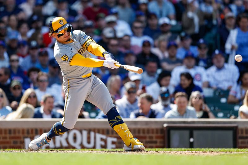 May 3, 2024; Chicago, Illinois, USA; Milwaukee Brewers catcher William Contreras (24) hits an RBI-single against the Chicago Cubs during the eight inning at Wrigley Field. Mandatory Credit: Kamil Krzaczynski-USA TODAY Sports