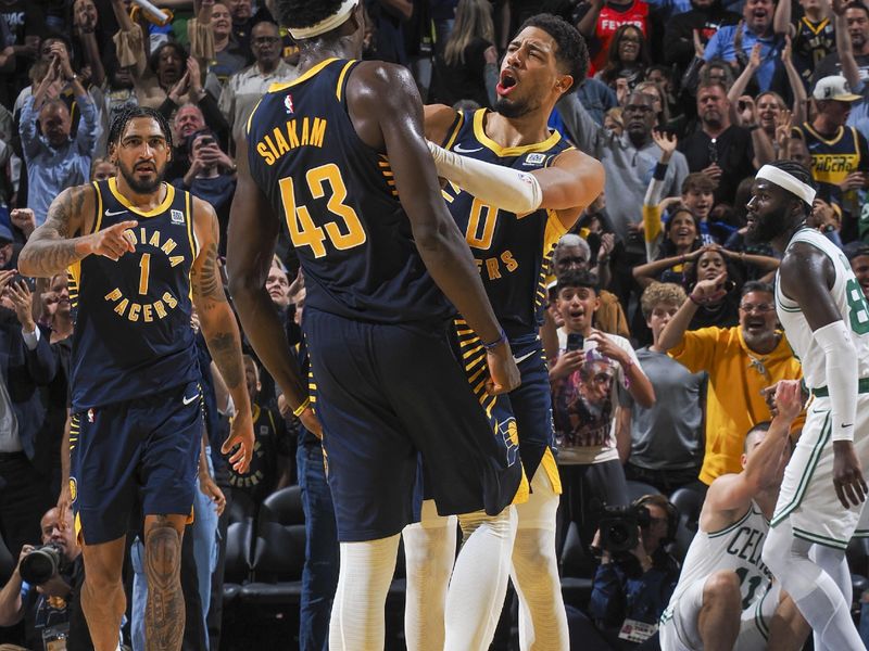 INDIANAPOLIS, IN - OCTOBER 30: Tyrese Haliburton #0 celebrates with teammate Pascal Siakam #43 of the Indiana Pacers after Siakam made a game-winning three-point field goal in overtime of the game against the Boston Celtics on October 30, 2024 at Gainbridge Fieldhouse in Indianapolis, Indiana. NOTE TO USER: User expressly acknowledges and agrees that, by downloading and or using this Photograph, user is consenting to the terms and conditions of the Getty Images License Agreement. Mandatory Copyright Notice: Copyright 2024 NBAE (Photo by Ron Hoskins/NBAE via Getty Images)