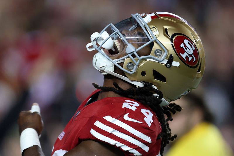 San Francisco 49ers running back Jordan Mason celebrates after scoring against the Dallas Cowboys during the second half of an NFL football game in Santa Clara, Calif., Sunday, Oct. 8, 2023. (AP Photo/Jed Jacobsohn)