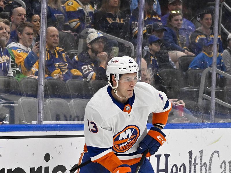 Feb 22, 2024; St. Louis, Missouri, USA;  New York Islanders center Mathew Barzal (13) controls the puck against the St. Louis Blues during the first period at Enterprise Center. Mandatory Credit: Jeff Curry-USA TODAY Sports