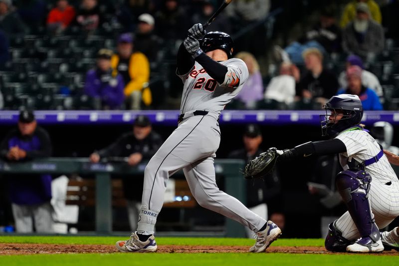 May 7, 2025; Denver, Colorado, USA; Detroit Tigers first base Spencer Torkelson (20) RBI doubles in the tenth inning against the Colorado Rockies at Coors Field. Mandatory Credit: Ron Chenoy-Imagn Images