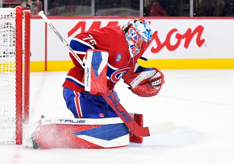 Dec 18, 2025; Montreal, Quebec, CAN; Montreal Canadiens goalie Jakub Dobes (75) makes a save against the Chicago Blackhawks during the second period at the Bell Centre. Mandatory Credit: Eric Bolte-Imagn Images