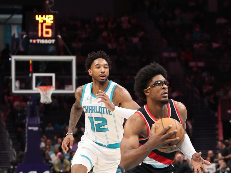 CHARLOTTE, NC - APRIL 3:  Scoot Henderson #00 of the Portland Trail Blazers drives to the basket during the game against the Charlotte Hornets on April 3, 2024 at Spectrum Center in Charlotte, North Carolina. NOTE TO USER: User expressly acknowledges and agrees that, by downloading and or using this photograph, User is consenting to the terms and conditions of the Getty Images License Agreement.  Mandatory Copyright Notice:  Copyright 2024 NBAE (Photo by Brock Williams-Smith/NBAE via Getty Images)