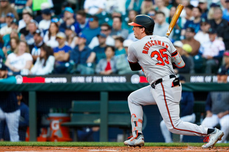 Jul 2, 2024; Seattle, Washington, USA; Baltimore Orioles catcher Adley Rutschman (35) hits a fielders choice against the Seattle Mariners during the fourth inning at T-Mobile Park. Mandatory Credit: Joe Nicholson-USA TODAY Sports