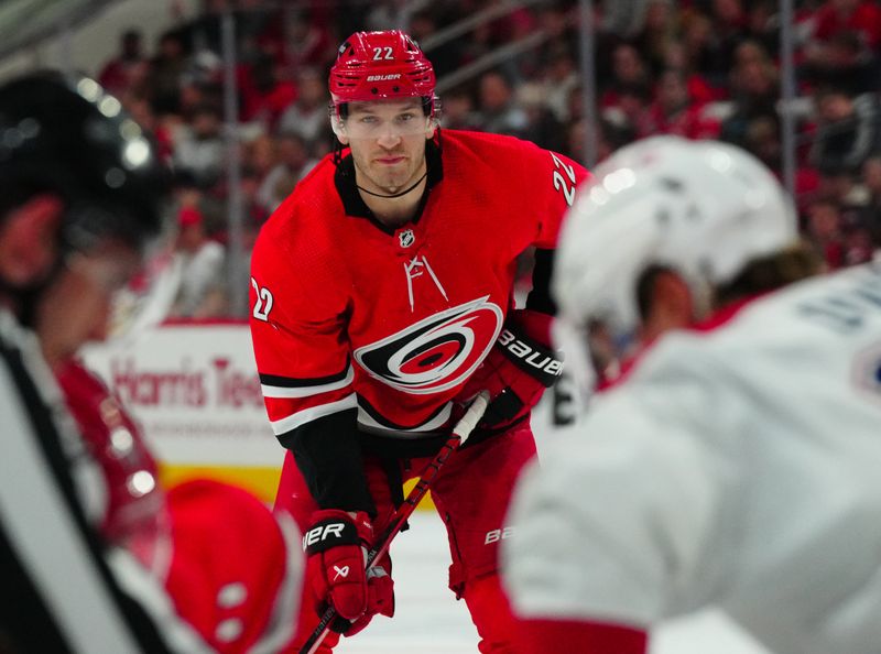 Dec 28, 2023; Raleigh, North Carolina, USA; Carolina Hurricanes defenseman Brett Pesce (22) looks on against the Montreal Canadiens during the first period at PNC Arena. Mandatory Credit: James Guillory-USA TODAY Sports