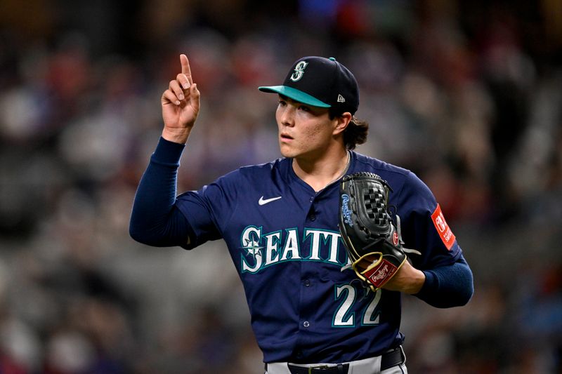 May 2, 2025; Arlington, Texas, USA; Seattle Mariners starting pitcher Bryan Woo (22) gives a thumbs up as he comes off the field after pitching against the Texas Rangers during the fourth inning at Globe Life Field. Mandatory Credit: Jerome Miron-Imagn Images