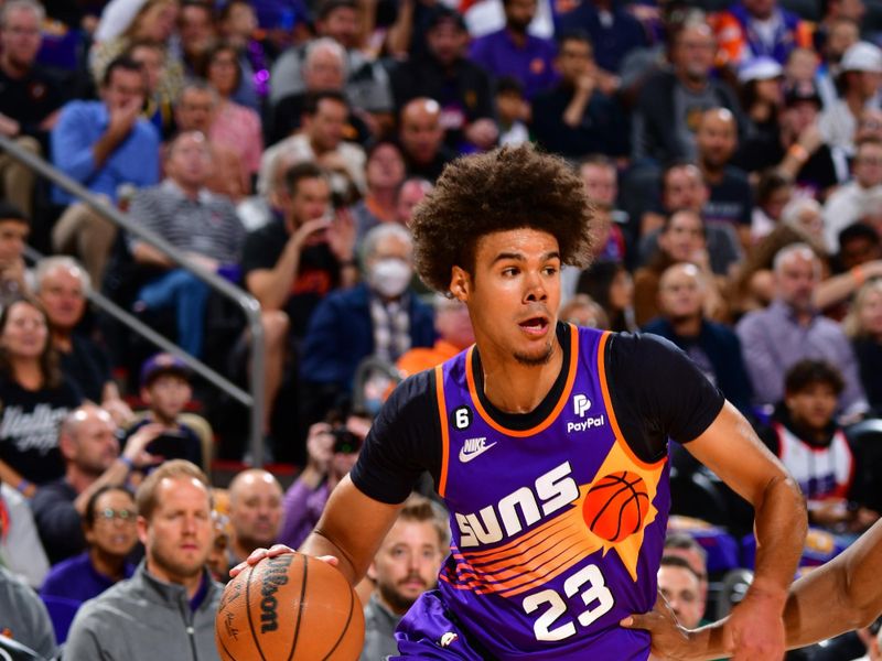 PHOENIX, AZ - OCTOBER 25: Cameron Johnson #23 of the Phoenix Suns drives to the basket during the game against the Golden State Warriors on October 25, 2022 at Footprint Center in Phoenix, Arizona. NOTE TO USER: User expressly acknowledges and agrees that, by downloading and or using this photograph, user is consenting to the terms and conditions of the Getty Images License Agreement. Mandatory Copyright Notice: Copyright 2022 NBAE (Photo by Barry Gossage/NBAE via Getty Images)