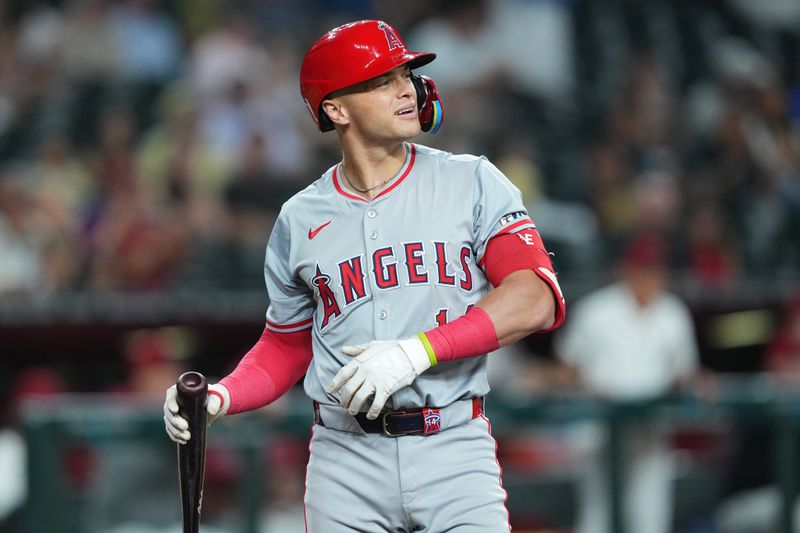 Jun 13, 2024; Phoenix, Arizona, USA; Los Angeles Angels catcher Logan O'Hoppe (14) reacts after striking out against the Arizona Diamondbacks during the first inning at Chase Field. Mandatory Credit: Joe Camporeale-USA TODAY Sports