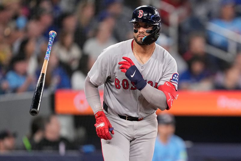 Apr 30, 2025; Toronto, Ontario, CAN; Boston Red Sox catcher Carlos Narvaez (75) tosses his bat after hitting a two-run home run against the Toronto Blue Jays during the sixth inning at Rogers Centre. Mandatory Credit: John E. Sokolowski-Imagn Images