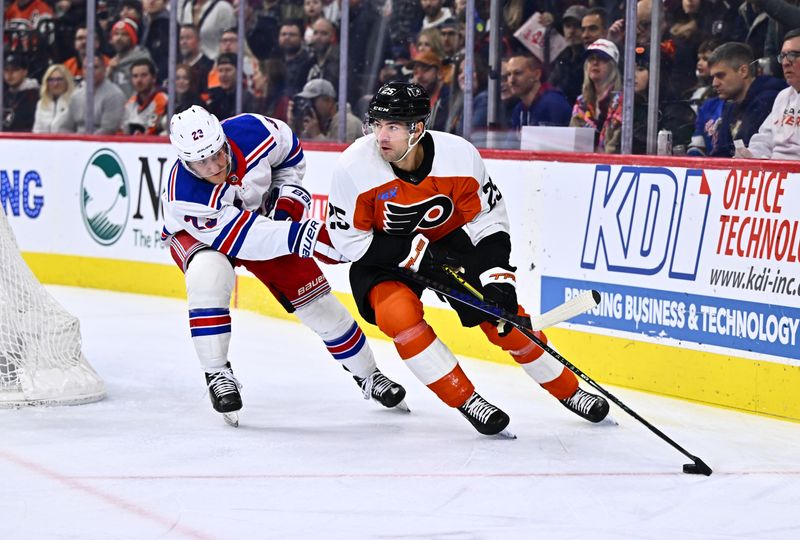 Feb 24, 2024; Philadelphia, Pennsylvania, USA; Philadelphia Flyers center Ryan Poehling (25) shields the puck against New York Rangers defenseman Adam Fox (23) in the first period at Wells Fargo Center. Mandatory Credit: Kyle Ross-USA TODAY Sports