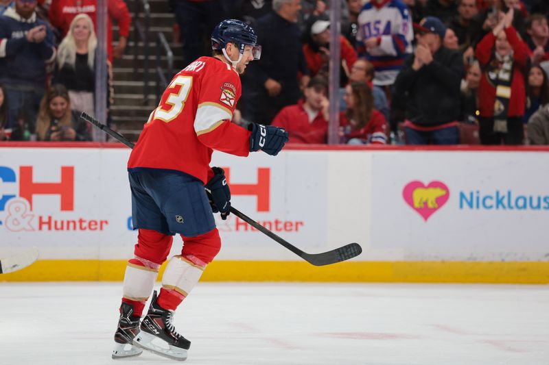 Dec 30, 2025; Sunrise, Florida, USA; Florida Panthers center Sam Reinhart (13) celebrates after scoring against the Montreal Canadiens during the third period at Amerant Bank Arena. Mandatory Credit: Sam Navarro-Imagn Images