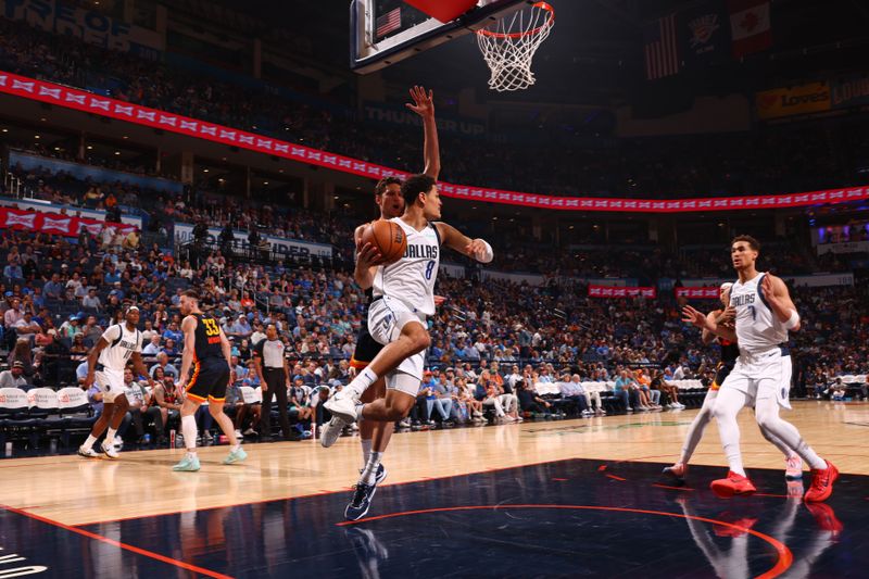 OKLAHOMA CITY, OK - APRIL 14: Josh Green #8 of the Dallas Mavericks handles the ball during the game against the Dallas Mavericks  on April 14, 2024 at Paycom Arena in Oklahoma City, Oklahoma. NOTE TO USER: User expressly acknowledges and agrees that, by downloading and or using this photograph, User is consenting to the terms and conditions of the Getty Images License Agreement. Mandatory Copyright Notice: Copyright 2024 NBAE (Photo by Zach Beeker/NBAE via Getty Images)