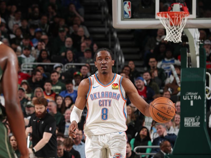 MILWAUKEE, WI - MARCH 24:  Jalen Williams #8 of the Oklahoma City Thunder handles the ball during the game against the Milwaukee Bucks on March 24, 2024 at the Fiserv Forum Center in Milwaukee, Wisconsin. NOTE TO USER: User expressly acknowledges and agrees that, by downloading and or using this Photograph, user is consenting to the terms and conditions of the Getty Images License Agreement. Mandatory Copyright Notice: Copyright 2024 NBAE (Photo by Gary Dineen/NBAE via Getty Images).