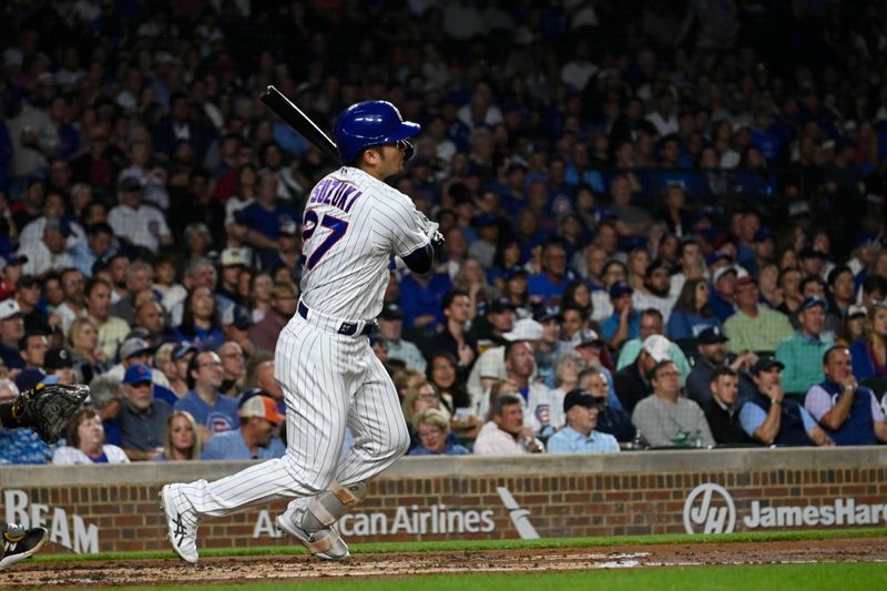 Sep 20, 2023; Chicago, Illinois, USA; Chicago Cubs right fielder Seiya Suzuki (27) hits an RBI single against the Pittsburgh Pirates during the second inning at Wrigley Field. Mandatory Credit: Matt Marton-USA TODAY Sports