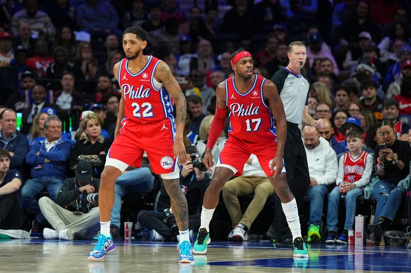 PHILADELPHIA, PENNSYLVANIA - FEBRUARY 9: Buddy Hield #17 and Cameron Payne #22 of the Philadelphia 76ers in action against the Atlanta Hawks at the Wells Fargo Center on February 9, 2024 in Philadelphia, Pennsylvania. The Hawks defeated the 76ers 127-121. NOTE TO USER: User expressly acknowledges and agrees that, by downloading and or using this photograph, User is consenting to the terms and conditions of the Getty Images License Agreement. (Photo by Mitchell Leff/Getty Images)