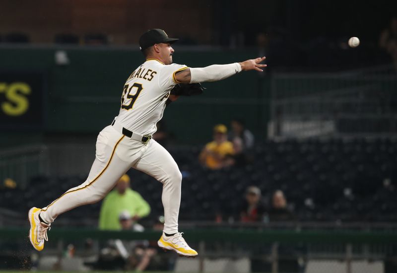 Jun 5, 2025; Pittsburgh, Pennsylvania, USA;  Pittsburgh Pirates second baseman Nick Gonzalez (39) throws to first base to retire Houston Astros left fielder Jacob Melton (not pictured) during the third inning  at PNC Park. Mandatory Credit: Charles LeClaire-Imagn Images