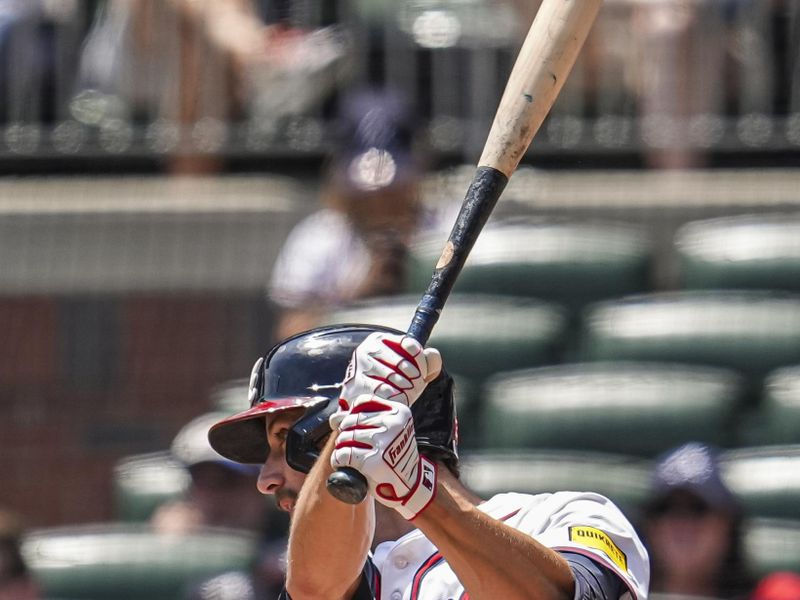 May 15, 2025; Cumberland, Georgia, USA; Atlanta Braves outfielder Eli White (36) hits a single to drive in a run against the Washington Nationals during the eighth inning at Truist Park. Mandatory Credit: Dale Zanine-Imagn Images