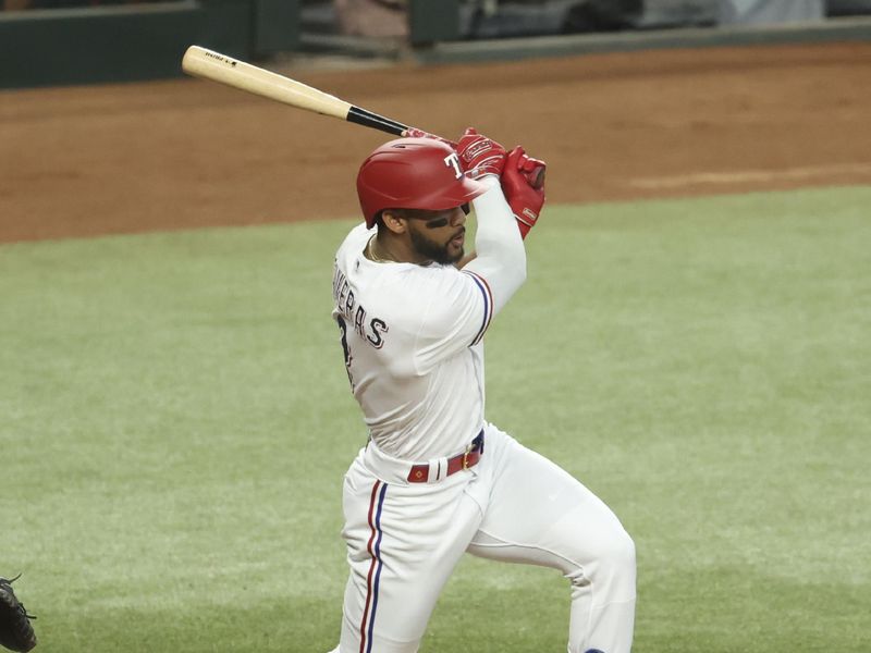 Jun 28, 2023; Arlington, Texas, USA;  Texas Rangers center fielder Leody Taveras (3) hits an rbi single during the first inning against the Detroit Tigers at Globe Life Field. Mandatory Credit: Kevin Jairaj-USA TODAY Sports