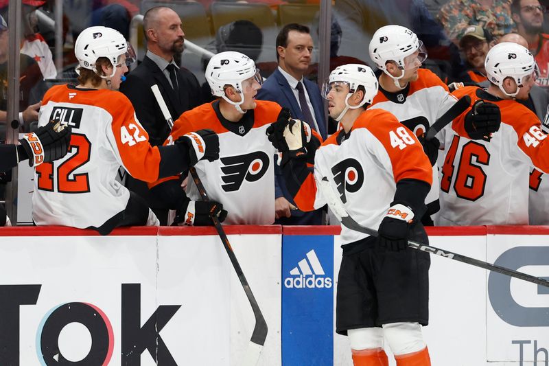 Sep 22, 2024; Washington, District of Columbia, USA; Philadelphia Flyers forward Morgan Frost (48) celebrates with teammates after scoring a goal against the Washington Capitals in the third period at Capital One Arena. Mandatory Credit: Geoff Burke-Imagn Images