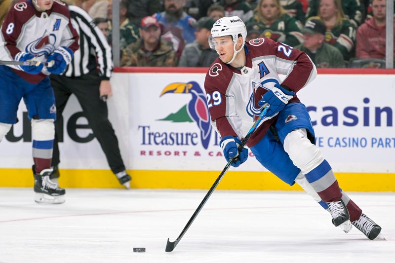 Nov 24, 2023; Saint Paul, Minnesota, USA; Colorado Avalanche forward Nathan MacKinnon (29) skates with the puck against the Minnesota Wild during the second period at Xcel Energy Center. Mandatory Credit: Nick Wosika-USA TODAY Sports