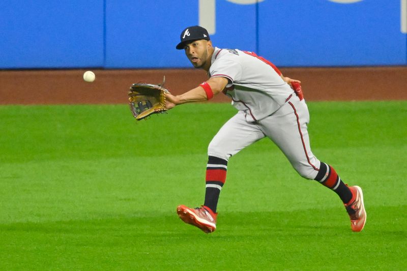 Jul 5, 2023; Cleveland, Ohio, USA; Atlanta Braves left fielder Eddie Rosario (8) makes a running catch in the eighth inning against the Cleveland Guardians at Progressive Field. Mandatory Credit: David Richard-USA TODAY Sports