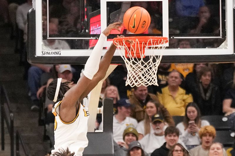 Feb 25, 2025; Columbia, Missouri, USA; Missouri Tigers guard Mark Mitchell (25) attempts a dunk against the x during the second half at Mizzou Arena. Mandatory Credit: Denny Medley-Imagn Images