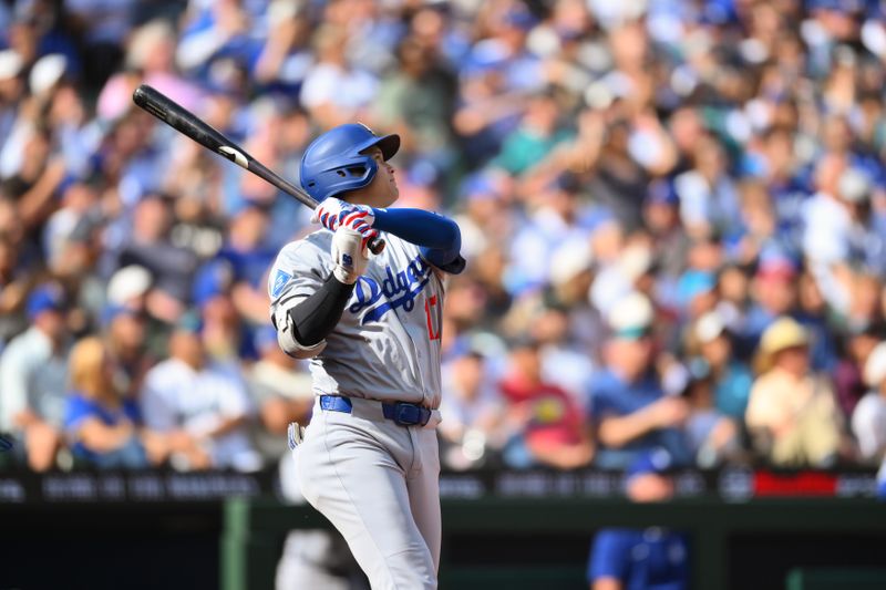 Sep 28, 2025; Seattle, Washington, USA; Los Angeles Dodgers designated hitter Shohei Ohtani (17) hits a home run against the Seattle Mariners during the seventh inning at T-Mobile Park. Mandatory Credit: Steven Bisig-Imagn Images