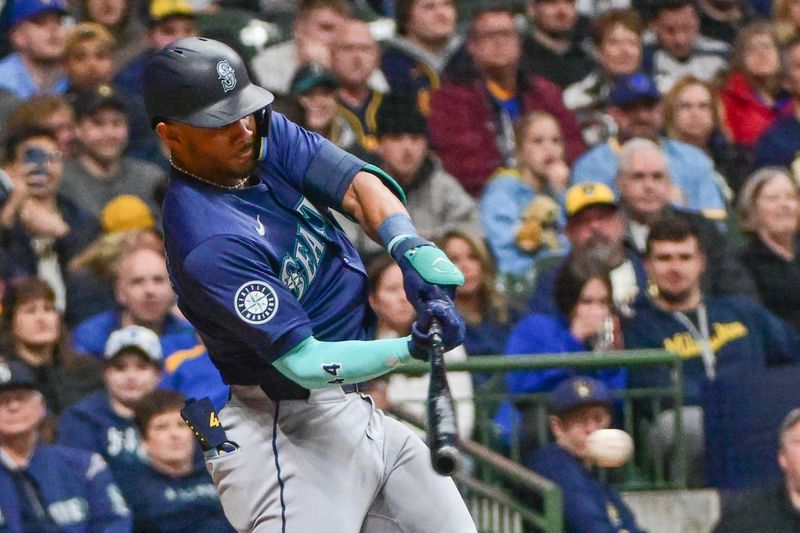 Apr 5, 2024; Milwaukee, Wisconsin, USA; Seattle Mariners center fielder Julio Rodriguez (44) grounds out to drive in a run in the ninth inning against the Milwaukee Brewers at American Family Field. Mandatory Credit: Benny Sieu-USA TODAY Sports