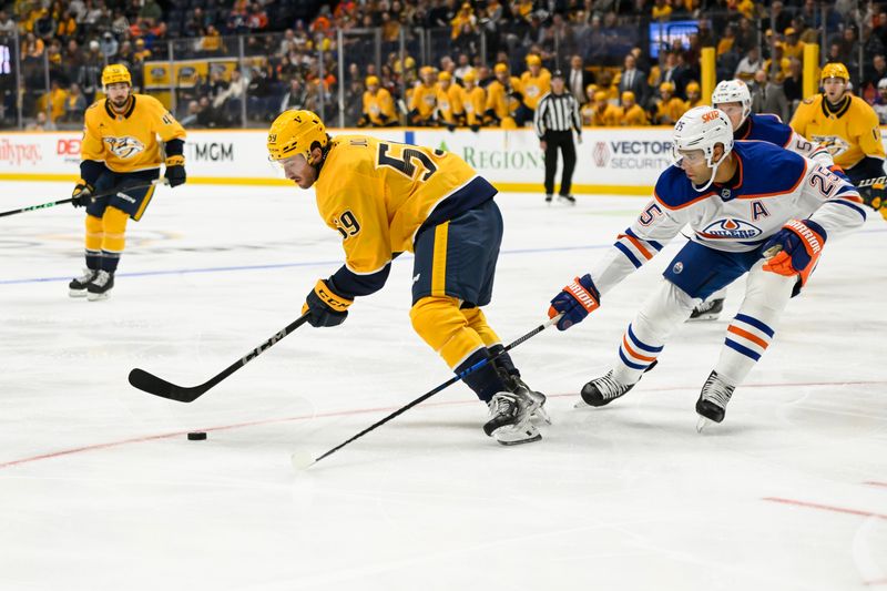 Oct 17, 2024; Nashville, Tennessee, USA;  Edmonton Oilers defenseman Darnell Nurse (25) pokes the puck from Nashville Predators defenseman Roman Josi (59) during the first period at Bridgestone Arena. Mandatory Credit: Steve Roberts-Imagn Images