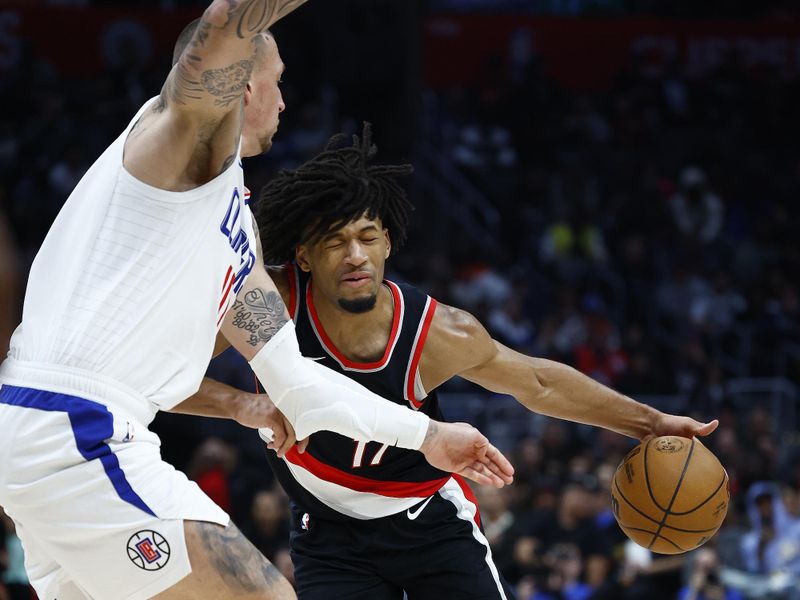 LOS ANGELES, CALIFORNIA - DECEMBER 11:  Shaedon Sharpe #17 of the Portland Trail Blazers controls the ball against Daniel Theis #10 of the LA Clippers in the second half at Crypto.com Arena on December 11, 2023 in Los Angeles, California.  NOTE TO USER: User expressly acknowledges and agrees that, by downloading and/or using this photograph, user is consenting to the terms and conditions of the Getty Images License Agreement. (Photo by Ronald Martinez/Getty Images)