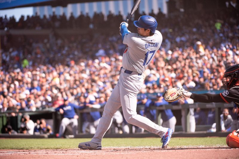 Jun 29, 2024; San Francisco, California, USA; Los Angeles Dodgers two-way player Shohei Ohtani (17) hits a home run during the third inning against the San Francisco Giants at Oracle Park. Mandatory Credit: Ed Szczepanski-USA TODAY Sports