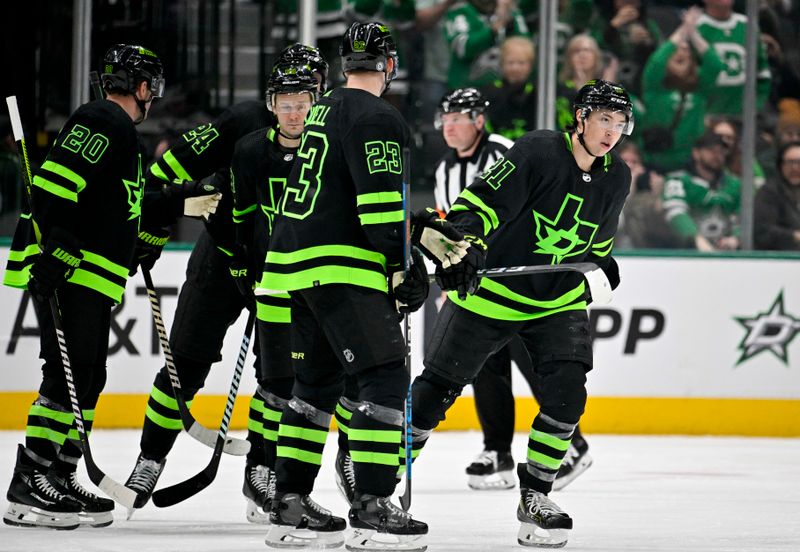 Jan 10, 2024; Dallas, Texas, USA; Dallas Stars left wing Jason Robertson (21) and center Roope Hintz (24) and defenseman Ryan Suter (20) and defenseman Esa Lindell (23) and right wing Evgenii Dadonov (63) celebrates a goal scored by Robertson against the Minnesota Wild during the third period at the American Airlines Center. Mandatory Credit: Jerome Miron-USA TODAY Sports