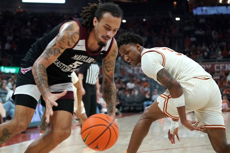 Dec 22, 2025; Austin, Texas, USA;Texas Longhorns guard Dailyn Swain (3) loses the ball to Maryland Eastern Shore Hawks forward Dorion Staple (5) during the first half at Moody Center. Mandatory Credit: Dustin Safranek-Imagn Images