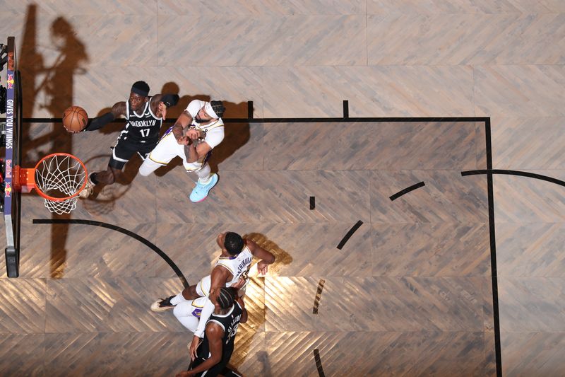 BROOKLYN, NY - MARCH 31: Dennis Schroder #17 of the Brooklyn Nets goes to the basket during the game on March 31, 2024 at Barclays Center in Brooklyn, New York. NOTE TO USER: User expressly acknowledges and agrees that, by downloading and or using this Photograph, user is consenting to the terms and conditions of the Getty Images License Agreement. Mandatory Copyright Notice: Copyright 2024 NBAE (Photo by Nathaniel S. Butler/NBAE via Getty Images)