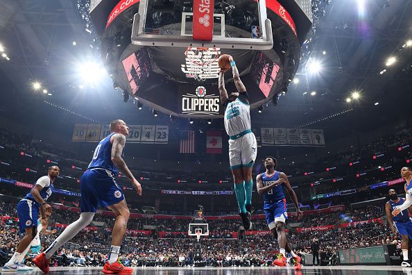 LOS ANGELES, CA - DECEMBER 26:  P.J. Washington #25 of the Charlotte Hornets goes to the basket during the game on December 26, 2023 at Crypto.Com Arena in Los Angeles, California. NOTE TO USER: User expressly acknowledges and agrees that, by downloading and/or using this Photograph, user is consenting to the terms and conditions of the Getty Images License Agreement. Mandatory Copyright Notice: Copyright 2023 NBAE (Photo by Juan Ocampo/NBAE via Getty Images)