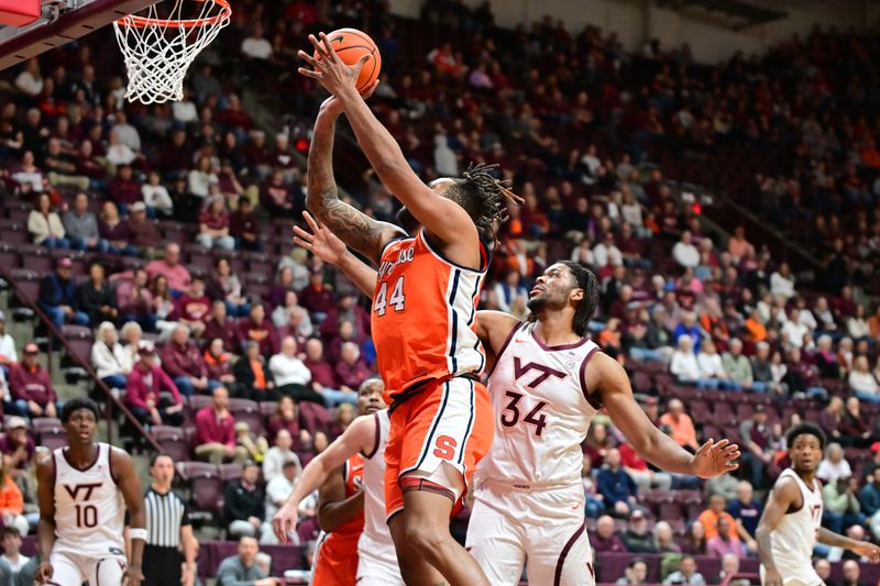 Mar 1, 2025; Blacksburg, Virginia, USA;  Syracuse Orange center Eddie Lampkin Jr. (44) goes up for a shot as Virginia Tech Hokies forward Mylyjael Poteat (34) defends at Cassell Coliseum. Mandatory Credit: Brian Bishop-Imagn Images