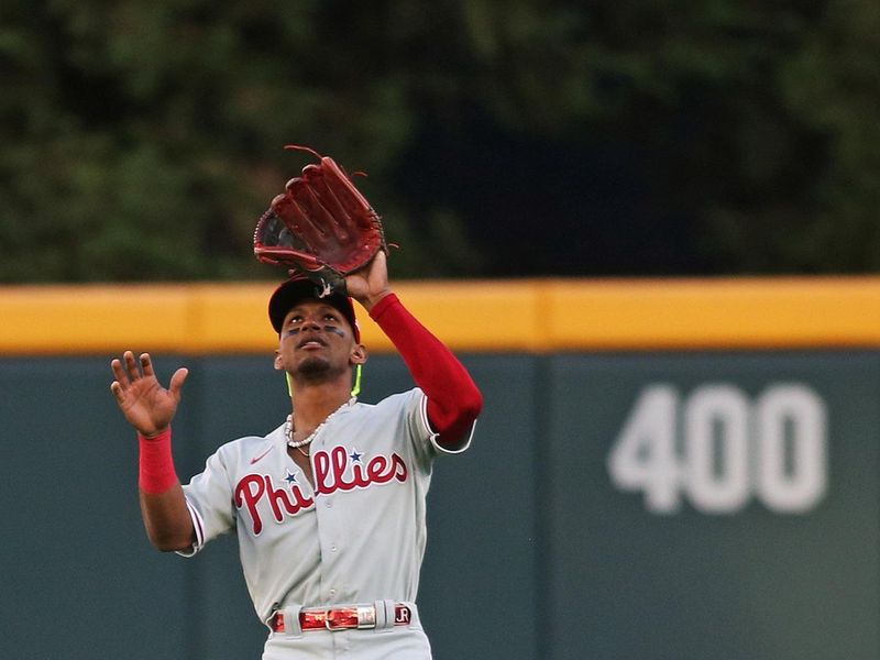 Oct 7, 2023; Cumberland, Georgia, USA; Philadelphia Phillies center fielder Johan Rojas (18) catches a fly ball during the first inning against the Atlanta Braves during game one of the NLDS for the 2023 MLB playoffs at Truist Park. Mandatory Credit: Brett Davis-USA TODAY Sports